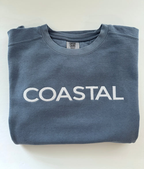 Coastal embroidery on a folded Blue Jean crewneck