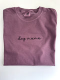 Dog mama embroidered in black script on a Berry tee