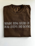 "Imagine being afraid of drag queens and books" embroidered tee in Espresso, folded flat with the collar showing