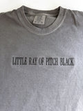 "Little ray of pitch black" embroidered tee in Pepper, laid flat, stitched tonal black on grey