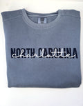 North Carolina in navy with Charlotte script in white, embroidered on a Blue Jean crewneck