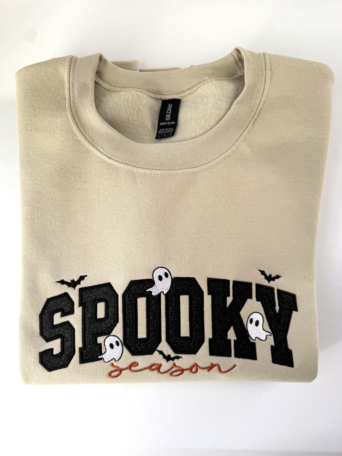 Spooky Season glitter appliqué crewneck in Sand with black glitter letters, orange script and white ghosts
